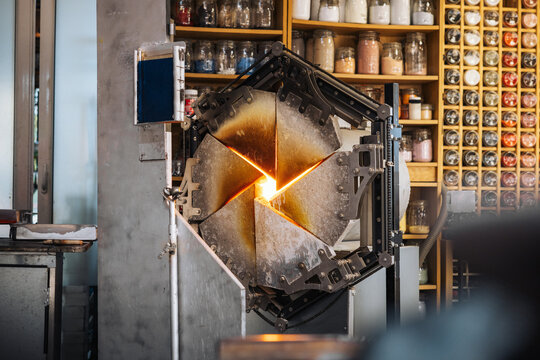 Glassblower crafting a Christmas bauble, from the heat of the oven to shaping it. Workshop based in France.