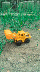 Construction car toys that boys like are made of plastic, small in size.