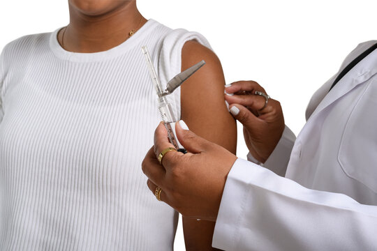 a female health worker vaccinates a young girl on the arm, close-up image on the arm, white background