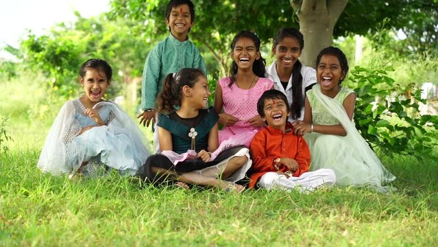 Indian cute little girls and boy enjoying life, smiling and celebrating indian festival rakhi or bhai duj