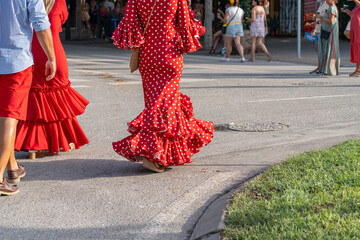 The essence of Andalusian culture captured in a vibrant flamenco dress adorned with polka dots. An...