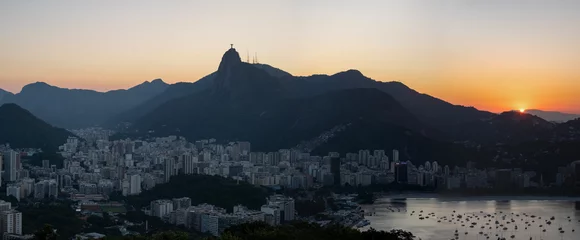 Fotobehang Rio de Janeiro, Brazil: panoramic view at sunset from Sugarloaf Mountain with view of Humaitá district, the Christ the Redeemer on top of Mount Corcovado, Botafogo district and beach © Naeblys
