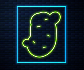 Glowing neon line Potato icon isolated on brick wall background. Vector