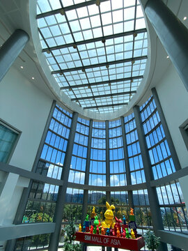 Pasay City, Manila, Philippines - August 15, 2023: Main entrance hall of a huge modern shopping mall
