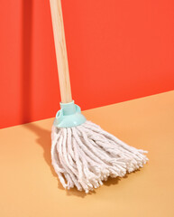 New mop for cleaning floors at home or in the office. Cleaning supplies.