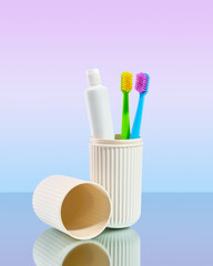 Plastic case with colorful toothbrushes and toothpaste. Set for dental hygiene.
