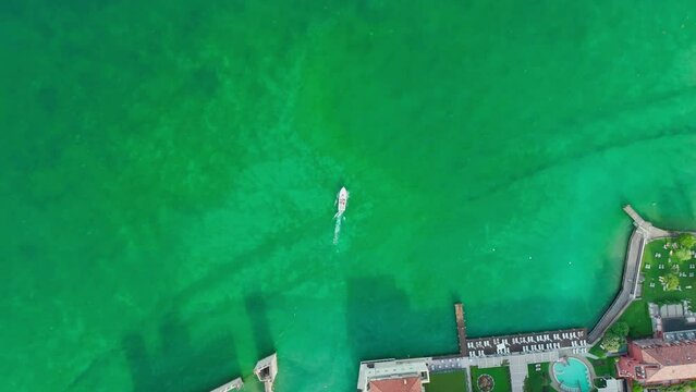 Aerial view of a boat sailing on Lago di Garda, Italy