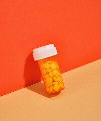 The jar orange color with a lot of pills. Health care.