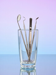 Dental tools in a glass. Concept of dental health.