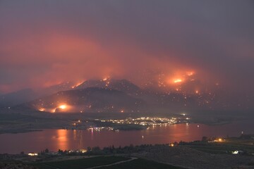 Blazing orange and yellow sky caused by a wildfire near Osoyoos Lake, British Columbia, Canada