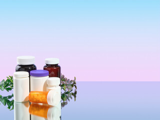 A lot of different jars of medicine. Vitamins, capsules, supplements, pills. Copy space for text.