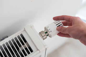 turning down thermostat on radiator to save energy due to heating cost price hike