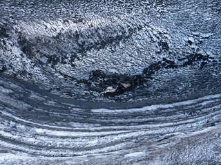 Naklejka premium Black and white ice next to the Dettifoss waterfall in Iceland