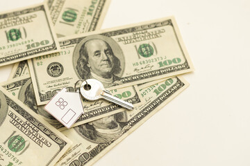 Savings concept. The key ring lies on the money