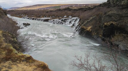 Closeup of beautiful Godafoss cascade under the blue sky in Iceland