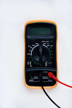 Multimeter on a white background. Voltage and current meter.