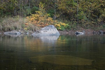 Scenic view of a rock shoreline of the Cheat River in West Virginia in autumn