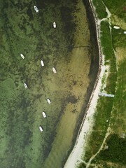 Aerial view of a fleet of sailboats in the port of a coastal town in Denmark