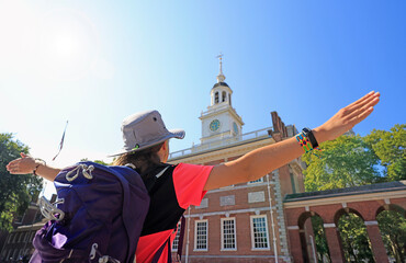 Young teenager girl tourist enjoying the Independence Hall in Philadelphia, Pennsylvania, USA 