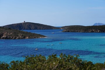 Stunning view of small boats floating in a calm turquoise sea