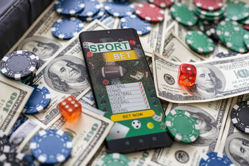 money and smartphone with sports bet application