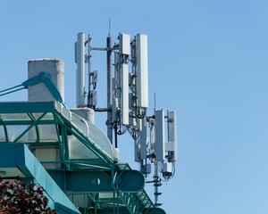 Radio tower with multiple antennas on top of a building