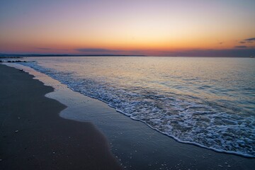 Seascape view at sunset with purple and clear sky background