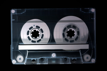 Retro audio cassette tape on a black background