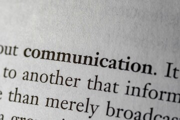 Close-up of a book page showing text related to communication