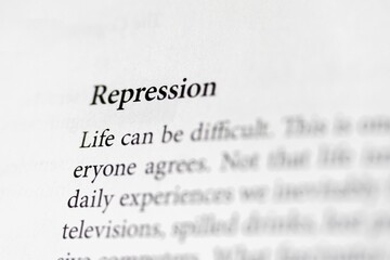 Close-up of the psychological term Repression, on paper background