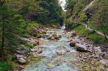 Scenic nature landscape view of Tolmin Gorge (Tolminska Korita) in Triglav National Park. Fast winding stream between mountains. Natural composition. Tolmin canyon, Soca Valley, Slovenia