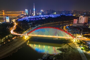 Fototapeta premium Aerial shot of the cityscape of Wuhan at nighttime, China.