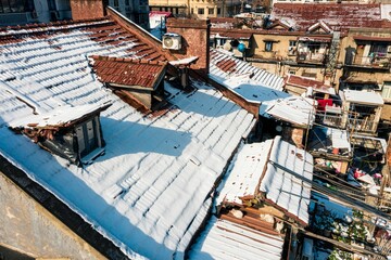 Fototapeta premium Aerial shot of buildings covered in snow in Wuhan, China.