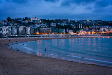 Urban beach of La Concha with the city of San Sebastian-Donostia illuminated at night, Donostia, Guipuzcoa, Spain