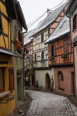 Charming Street with Old Houses in Beautiful village Eguisheim, in christmas time, Alsace, France