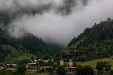 Fototapeta premium Aerial view of a town in green mountains in Mestia, Georgia