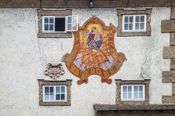 Sundial in secco painting from 1628 on Zeugwartstöckl, historic building on Mozartplatz, Salzburg, Austria