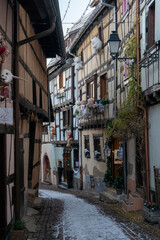 Charming Street with Old Houses in Beautiful village Eguisheim, in christmas time, Alsace, France