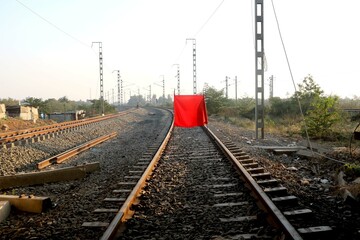 The longest railroad tracks with stop red flag close signal