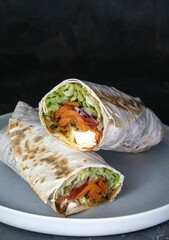 Vegetarian wrap with lots of lettuce, vegetables and feta cheese