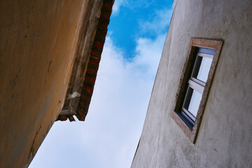 Fototapeta na wymiar Looking up from a narrow street of Alfama, Lisbon.