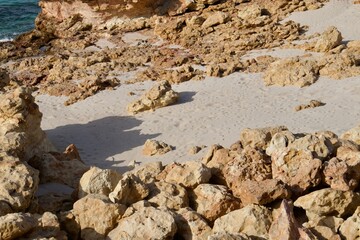 Scenic view of a rocky shoreline situated along the edge of a body of water