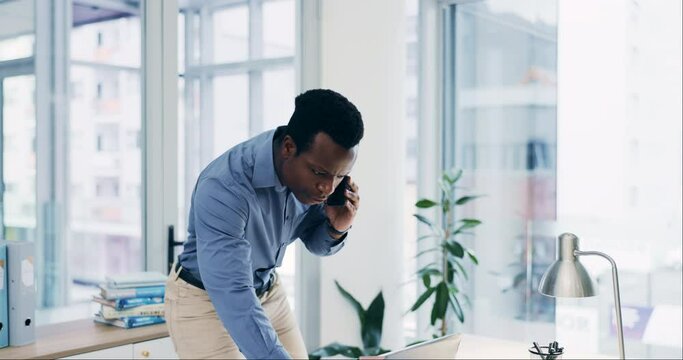 Phone call, laptop and black man in business, typing and communication in office. Smartphone, computer and serious professional in negotiation, contact research and consultant networking for email