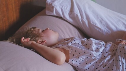 Cute Adorable Little Girl Child Sleeping Peacefully during Midday Nap Time Having Beautiful Dream