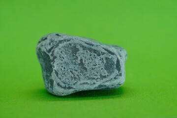 Natural mineral on a green background with crystal quartz crystals