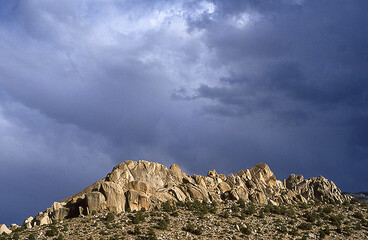 Rock Formation and Stormy Sky