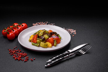 Delicious juicy fresh salad of baked eggplant, tomatoes, zucchini, onions