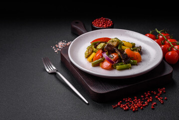 Delicious juicy fresh salad of baked eggplant, tomatoes, zucchini, onions