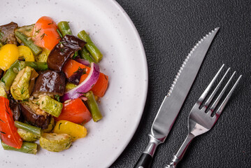 Delicious juicy fresh salad of baked eggplant, tomatoes, zucchini, onions