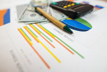 Accounting charts and charts, Pen on paper charts. Business report, analysis, income.